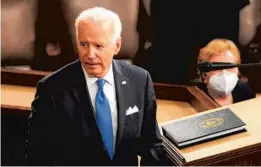  ?? ANDREW HARNIK/AP ?? President Biden’s next 100 days in office will focus on his push to pass his expansive plans on infrastruc­ture and children, families and education, which would expand the social safety net for children and increase taxes on the wealthy.