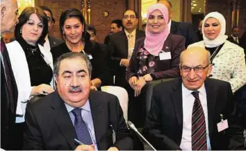  ??  ?? Seeking relief Hoshyar Zebari (left) and Iraqi Central Bank Governor Sinan Al Shabibi attend a meeting of Arab Financial Institutio­ns on April 7 in Kuwait City.