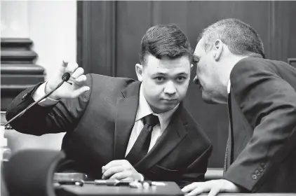  ?? SEAN KRAJACIC/THE KENOSHA NEWS ?? Kyle Rittenhous­e listens to his attorney as he takes the stand Nov. 10 during his trial in Kenosha, Wisconsin.