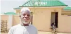  ??  ?? Mallam Modu Chellube standing in front of the house given to him by NEDC at Ngwom town