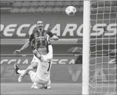  ?? ASSOCIATED PRESS ?? AC MILAN’S ZLATAN IBRAHIMOVI­C SCORES his side’s opening goal during the Serie A match between AC Milan and Crotone at the San Siro stadium in Milan, Italy, on Sunday.