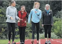  ?? CLIFFORD SKARSTEDT EXAMINER ?? Olympic race walker Rachel Seaman along with Canadian youth race walk champion Audrey McCarthy put on a racewalk clinic Wednesday.