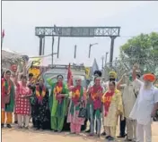  ?? HT PHOTO ?? Farmers protesting at the main gate of the Adani Group’s inland container depot at Kila Raipur.