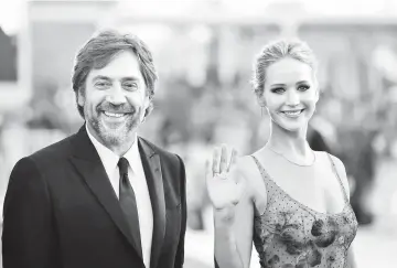  ??  ?? Lawrence (right) and Bardem pose during a red carpet for the movie ‘Mother!’ at the 74th Venice Film Festival in Venice, Italy, recently. — Reuters file photo