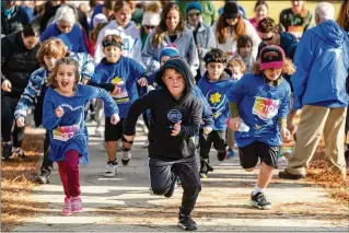  ?? ?? The kids’ 1K race at the Daffodil Dash followed the 5K run. Two former Atlanta residents who died during the Israel-Hamas War, Rose Lubin and Dekel Swissa, were honored at the Daffodil Dash.