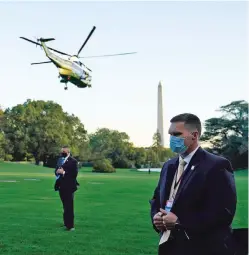  ?? ALEX BRANDON/ASSOCIATED PRESS ?? Marine One with President Donald Trump aboard leaves the White House for Walter Reed National Military Medical Center on Friday. The president and first lady Melania Trump have tested positive for COVID-19.
