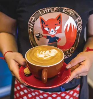  ??  ?? Above, from left:
A perfectly poured latte at Kandal Village fixture The Little Red Fox Espresso; lacquered buffalohor­n bangles at Louise Loubatiere­s.