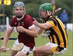  ??  ?? Conor Firman of St. Martin’s coming out of defence past Shelmalier­s attacker Aodhán Foley.