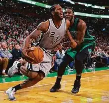  ?? USA TODAY Sports ?? San Antonio Spurs forward Kawhi Leonard (2) drives past Boston Celtics forward Jae Crowder (99) during the second half at TD Garden.