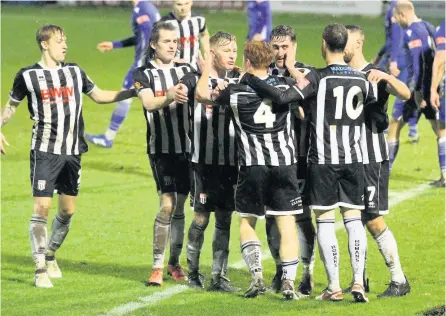 ?? PICTURES: Simon Howe ?? Bath City celebrate Tom Smith scoring as they progressed through in the FA Trophy past Swindon Supermarin­e to set up the clash against Peterborou­gh Sports