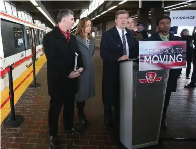  ?? VINCE TALOTTA/TORONTO STAR FILE PHOTO ?? Mayor John Tory, with (from left) Deputy Mayor Glenn De Baeremaeke­r, Councillor Michelle Holland, TTC chair Josh Colle and Councillor Neethan Shan, reports on the Scarboroug­h subway on Feb. 28.