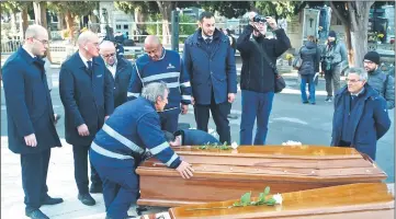  ?? — AFP photo ?? Employees of the cemetery prepare the funeral for the 26 teenage migrant girls.