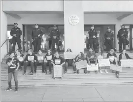  ?? COURTESY OF JON RODNEY ?? Activists protested outside the Alameda County Sheriff’s Office this week following the department’s accidental retweet of a live-stream video by a white supremacis­t.