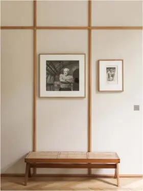  ??  ?? above this wall in the bedroom is clad with linen, which adds a softness to the interior. a portrait of picasso by andré villers and a gérard garouste drawing hang on the wall above a vintage teak and cane bench by pierre jeanneret bathroom carrara marble reigns in this calm space, with two takashi murakami screenprin­ts injecting a dose of colour above the bath. the stool is the ‘butterfly’ by sori
yanagi for vitra and the tub is from hidrobox’s ‘beta essential’ collection stockist details on p 194 ➤