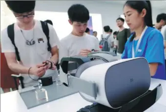  ?? REUTERS ?? A new Xiaomi VR headset is displayed during a product launch in Shenzhen, Guangdong province, in May.