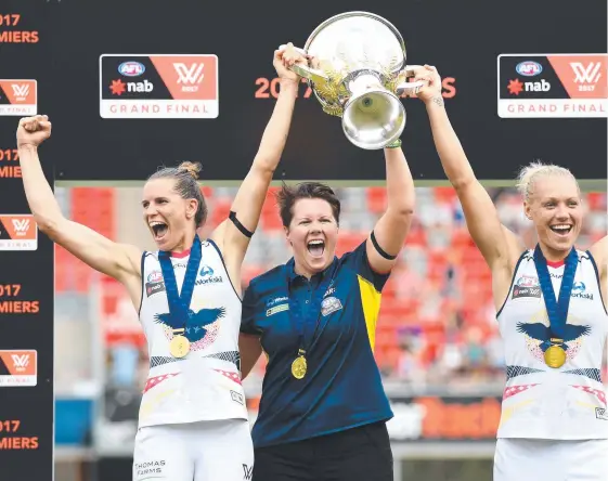  ?? Picture: AAP IMAGE ?? Coach Bec Goddard with Adelaide co-captains Chelsea Randall (left) and Erin Phillips after the Crows’ 2017 AFLW premiershi­p triumph.