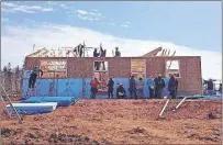  ?? SUBMITTED PHOTO ?? Volunteers are at work during a Habitat for Humanity build day at one of the projects.