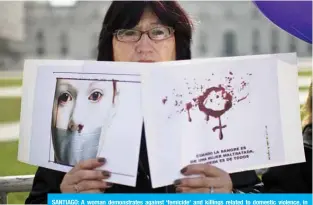  ?? —AFP ?? SANTIAGO: A woman demonstrat­es against ‘femicide’ and killings related to domestic violence, in front of the La Moneda presidenti­al palace in Santiago.