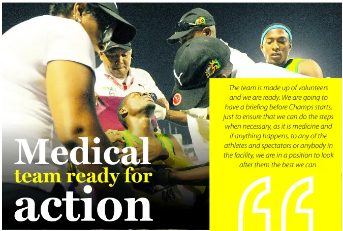  ?? GLADSTONE TAYLOR ?? Members of the medical team attend to an injured athlete at the 2017 staging of the ISSA/GraceKenne­dy Boys and Girls Athletics Championsh­ips.
