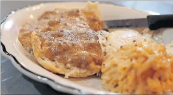  ?? [ANDREA NOALL/DISPATCH] ?? The Short North: a buttermilk biscuit, sausage gravy, egg and cheesy hash browns at Branch