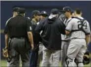  ?? CHRIS O’MEARA — THE ASSOCIATED PRESS ?? New York Yankees starting pitcher Masahiro Tanaka, second from right, of Japan, talks to catcher Gary Sanchez and pitching coach Larry Rothschild as he struggles during the first inning of a baseball game against the Tampa Bay Rays, Sunday in St....