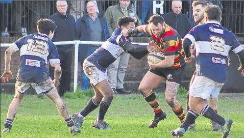  ??  ?? Ashford’s Jamie Farris prises open the Old Dunstonian­s defence on Saturday