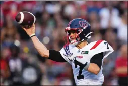  ?? THE CANADIAN PRESS SEAN KILPATRICK ?? Montreal Alouettes quarterbac­k Trevor Harris throws a pass during first half CFL action against the Ottawa Redblacks in Ottawa on July 21.