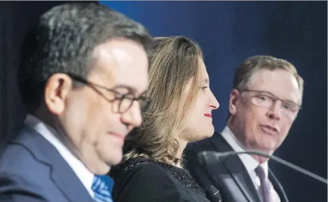  ?? GRAHAM HUGHES/THE CANADIAN PRESS FILES ?? Sources familiar with NAFTA talks say top negotiator­s likely won’t get back to work this month as Canadian Foreign Minister Chrystia Freeland, centre, is in Europe this week, U.S. Trade Representa­tive Robert Lighthizer is scheduled to be on vacation...