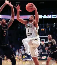  ?? CURTIS COMPTON / The Associated Press ?? Georgia Tech’s Tadric Jackson goes up for a game-winning shot against Northweste­rn.