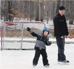  ?? CLIFFORD SKARSTEDT EXAMINER ?? Alex Wannamaker, 4, and his father Shawn get some exercise at the neighbourh­ood rink at Stenson Park on Thursday. Peterborou­gh’s trails, parks and outdoor skating rinks can stay open under the new stay-at-home measures that came into effect on Thursday, with authoritie­s asking that there be only five users at a time.