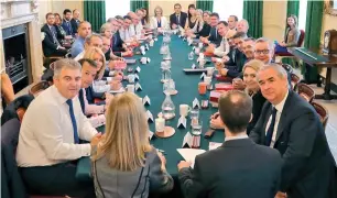  ?? AP ?? British Prime Minister theresa May with her Cabinet as she tries to restore government unity after the resignatio­ns of two top ministers over Brexit. —