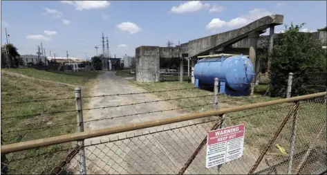  ??  ?? A gate at the U.S. Oil Recovery Superfund site is shown Thursday, in Pasadena, Texas, where three tanks once used to store toxic waste were flooded during Hurricane Harvey. AP PHOTO