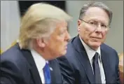  ?? Pablo Martinez Monsivais Associated Press ?? PRESIDENT Trump with NRA leader Wayne LaPierre in 2017. LaPierre spoke to Trump by phone this month after the president talked about new gun laws.