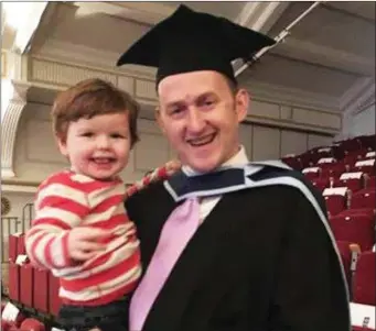  ??  ?? James O’Donoghue (right) pictured after his graduation with his son, Eamonn.