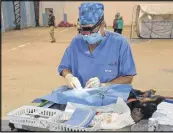  ?? SUBMITTED ?? Gwen Mowbray-cashen used a headlamp for extra lighting while performing surgery at a World Vets spay/neuter clinic in Ecuador.