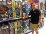  ?? PEG DEGRASSA — DIGITAL FIRST MEDIA ?? Bruce Bush, the manager of Phantom Fireworks in Upland, stands in one of the aisles full of reloadable mortar and shell kits inside the store. Bush said mortars
