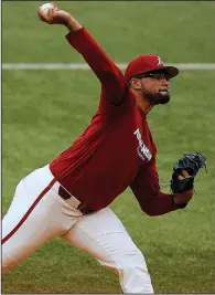  ?? Arkansas Democrat-Gazette/THOMAS METTHE ?? Isaiah Campbell threw three shutout innings to lead University of Arkansas pitching in an 11-2 victory over the University of Arkansas at Little Rock on Friday at Gary Hogan Field in Little Rock.