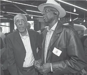  ?? MATT KRYGER/ INDYSTAR ?? Donnie Freeman, left, talks with Frank Card during the ABA 50th anniversar­y reunion at Bankers Life Fieldhouse on April 7, 2018.