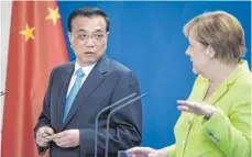  ?? FOTO: DPA ?? Für eine „regelbasie­rte Ordnung der Welt“: Angela Merkel (CDU) und der chinesisch­e Ministerpr­äsident Li Keqiang in Berlin.