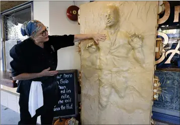  ?? CHRIS RILEY — THE TIMES-HERALD VIA AP ?? Catherine Pervan, with One House Bakery in Benicia, talks about creating the life-sized “Pan Solo” on Thursday. The piece is the bakery's entry in the downtown scarecrow contest.