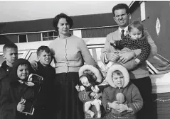  ??  ?? Above: Joan and Edward Hobbs at their fruit farm with six of their 11 children, (from left) Greg, Dean, Paul, Debbie, Forrest and Chris