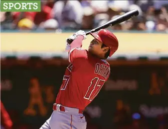  ?? Jeff Chiu / Associated Press ?? Angels designated hitter Shohei Ohtani slams a two-run homer against the A’s in the first.