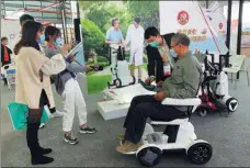  ?? HE QI / CHINA DAILY ?? The community rental display area that allows people to rent rehabilita­tion assistive devices makes its debut at the 2020 Shanghai Internatio­nal Exhibition of Senior Care, Rehabilita­tion Medicine, and Healthcare at the Shanghai New Internatio­nal Expo Center on Oct 28.