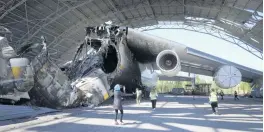  ?? EFREM LUKATSKY AP ?? The remains of the Antonov An-225, which was the world’s biggest cargo aircraft and was destroyed during fighting between Russian and Ukrainian forces, are displayed at the Antonov airport in Hostomel on the outskirts of Kyiv, Ukraine, on Thursday.