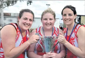  ??  ?? Sweet: Mundy sisters Kate, Laura and Rachael savour the triumph.