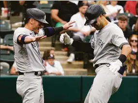  ?? Nam Y. Huh / Associated Press ?? The Yankees’ Joey Gallo, right, celebrates with Josh Donaldson after hitting a two-run home run against the White Sox in the ninth inning on Sunday.