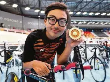  ??  ?? Para cyclist Adi, 17, won Malaysia’s first gold at the 9th Asean Para Games. — GLENN GUAN/The Star