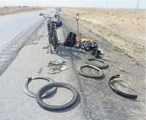  ??  ?? Puncture on the road to Esfahan.