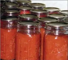  ?? LEE REICH VIA ASSOCIATED PRESS ?? Canned tomatoes in jars in New Paltz, N.Y. A pot of tomatoes, cooked down, blended, and then canned, brings some summer-y flavor to the dead of winter.