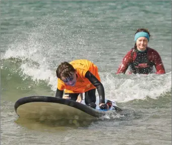  ??  ?? Participan­ts with autism found the water soothing and therapeuti­c, many progress to mainstream surf lessons and some previous participan­ts are surfing on a regular basis.